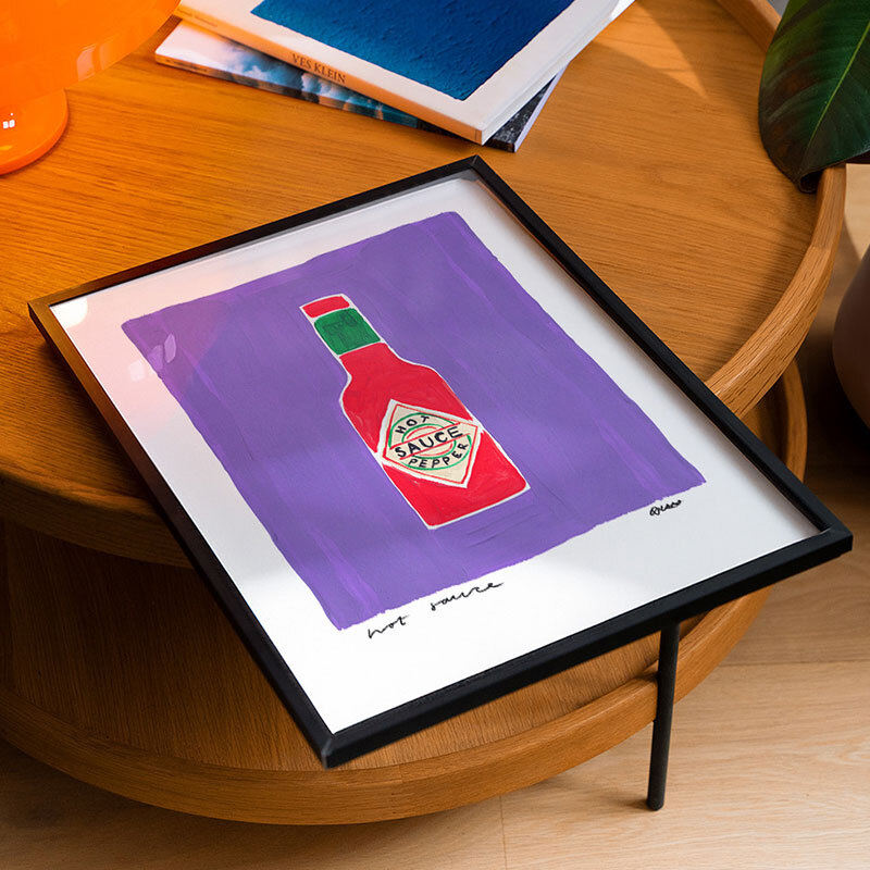 Purple hot sauce art print by natalie cass in black frame