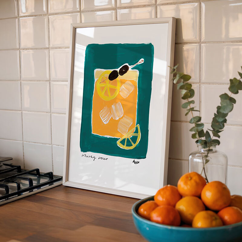 Whiskey sour art print by natalie cass in white frame.