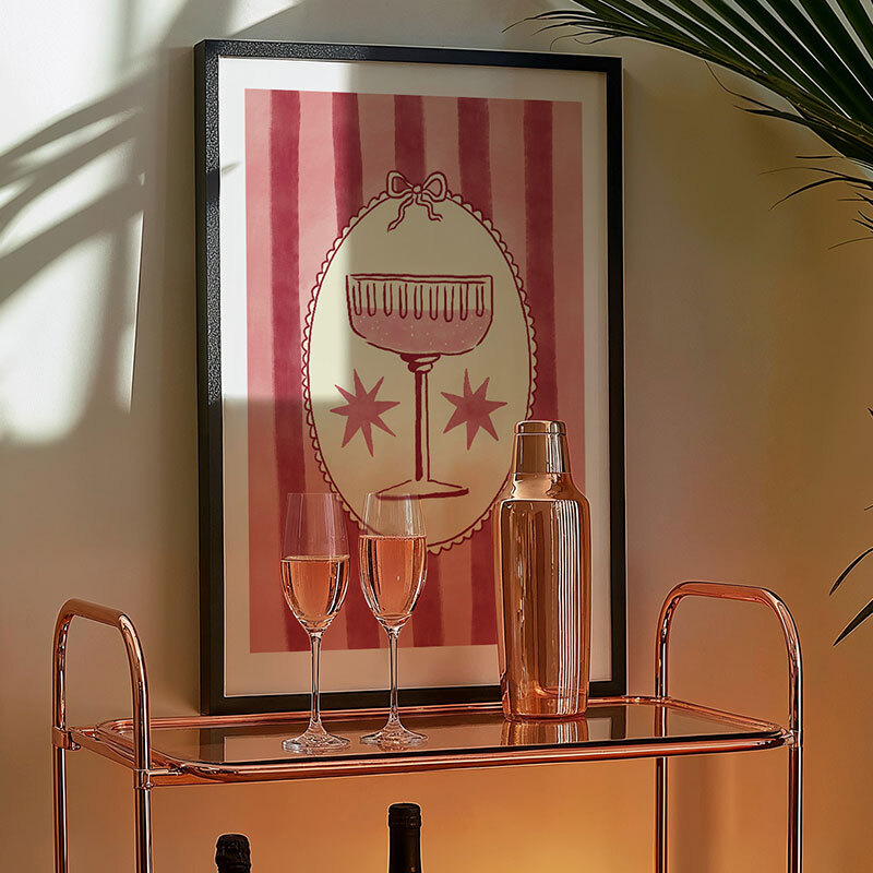 pink champagne art print by nice draws in black frame