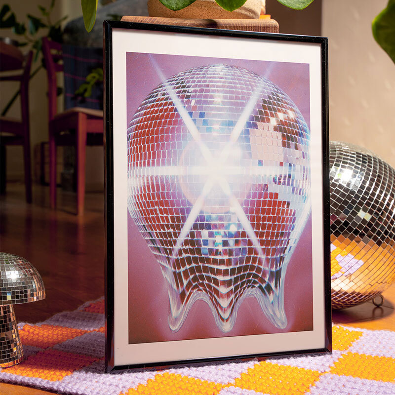 melting disco ball art print by sammy hearn in black frame