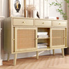 A modern retro sideboard with rattan doors, three drawers, and stylish legs for versatile storage.