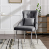 Elegant velvet dining chair with ergonomic lumbar support and sturdy metal legs.