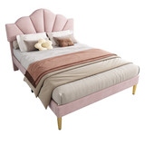 The bed has a velvet frame, adjustable shell-shaped headboard, golden legs, and a slatted wooden-metal base.