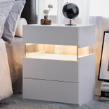 This modern LED nightstand features an acrylic panel, multi-color RGB lights, and spacious storage with 3 drawers for a stylish and functional design.