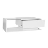 A coffee table with a glass top, storage drawers, and RGB LED lighting.