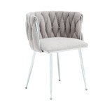 Set of 2 handwoven dining chairs with silver legs and armrests.