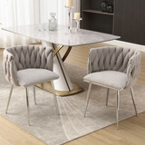 Modern handwoven dining chairs with silver legs, armrests, and high-density cushion.