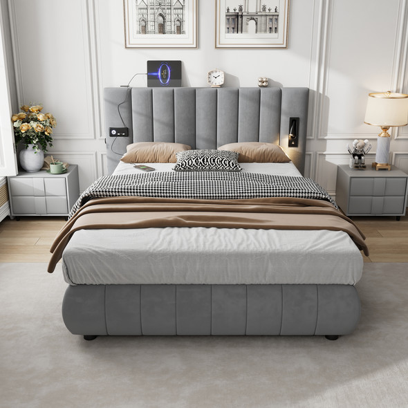 A modern upholstered bed with a soft velvet headboard, built-in stereo, charging ports, and reading light for a stylish and functional bedroom.