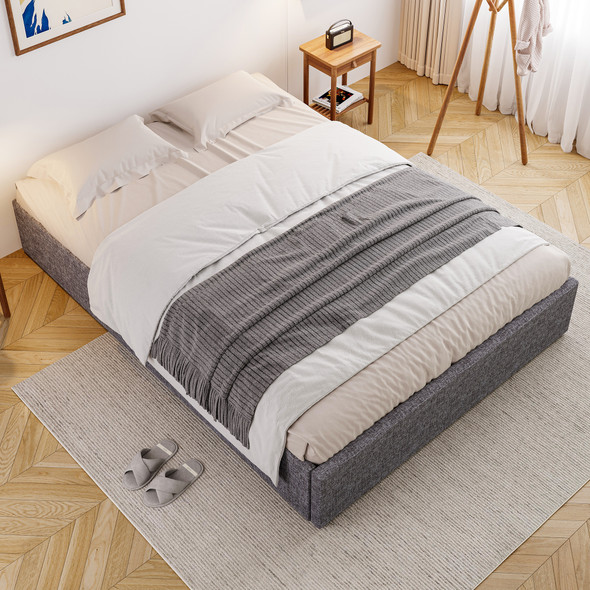 A grey upholstered storage bed with four under-bed drawers, iron frame, and a modern, simple design.