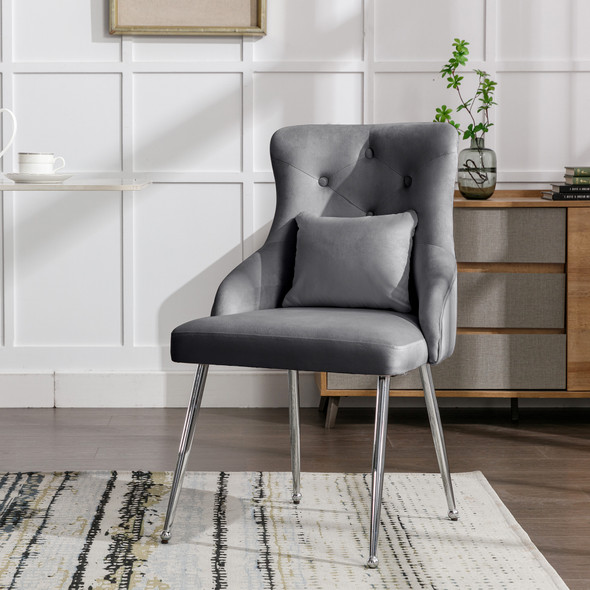 Elegant velvet dining chair with ergonomic lumbar support and sturdy metal legs.