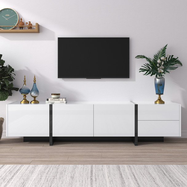 A modern black and white TV cabinet with high-gloss finish, color-blocking design, and spacious storage.