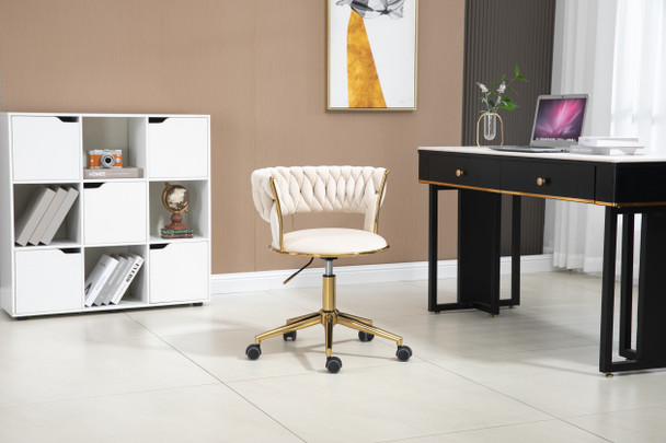This velvet office chair combines style and comfort with a handwoven backrest, adjustable height, and a luxurious gold base.