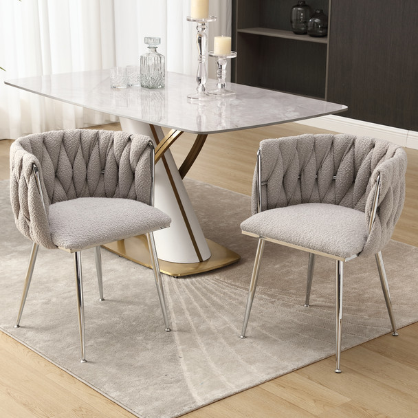 Modern handwoven dining chairs with silver legs, armrests, and high-density cushion.