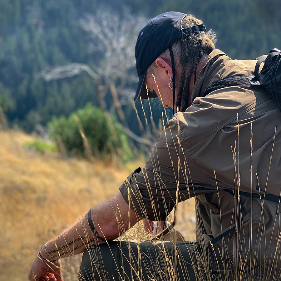 Shawn Donnille, Owner of Mountain Rose Herbs looking contemplative in an open field. 