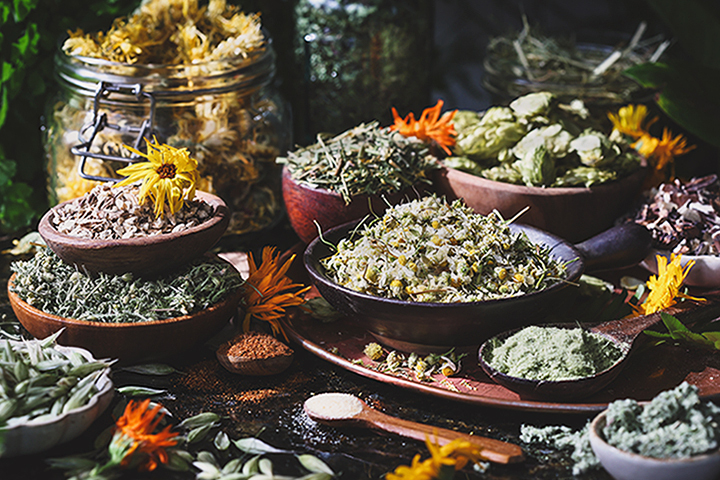 Bowls of colorful dried herbs