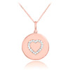 Heart disc pendant necklace with diamonds in 14k rose gold.