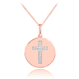Cross disc pendant necklace with diamonds in 14k rose gold.