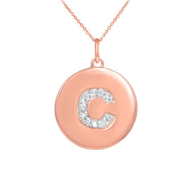 Letter "C" disc pendant necklace with diamonds in 14k rose gold.