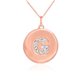 Letter "G" disc pendant necklace with diamonds in 14k rose gold.