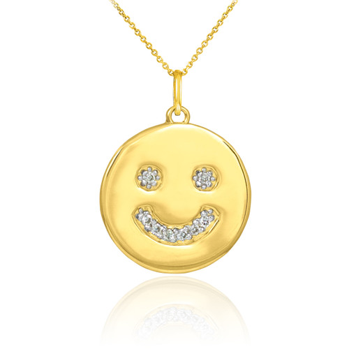 Smiley face disc pendant necklace with diamonds in 14k yellow gold.
