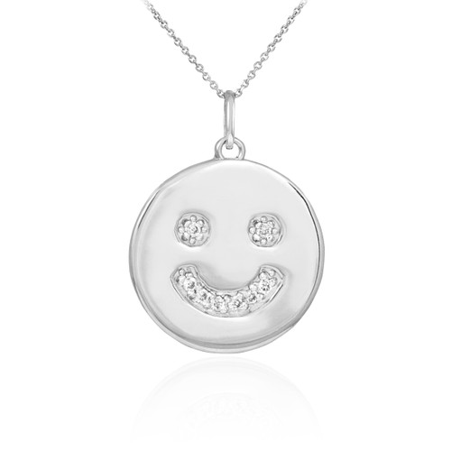 Smiley face disc pendant necklace with diamonds in 14k white gold.