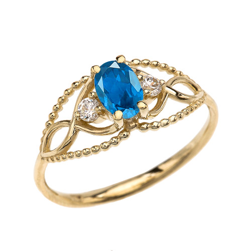 Elegant Beaded Solitaire Ring With Blue Topaz Centerstone and White Topaz in Yellow Gold