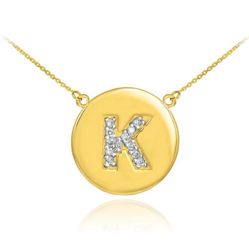 Letter "K" disc necklace with diamonds in 14k yellow gold.