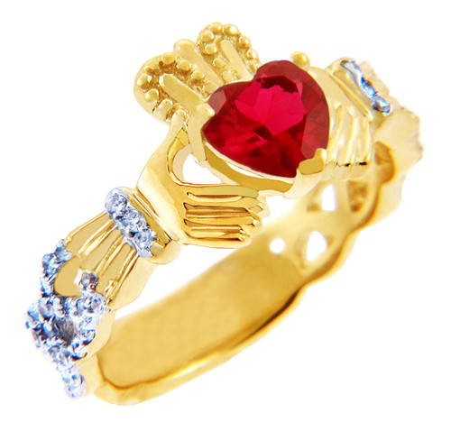 Gold Diamond Claddagh Ring with 0.40 Carats of diamonds and a Garnet Birthstone.  Available in 14k and 10k Gold.
