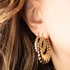 14K Yellow Gold Reversible Croissant Hoop Earrings on female model