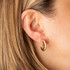 Yellow Gold Diamond Cut Ribbed Hoop Stud Earrings on female model