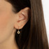 Yellow Gold Jewish Star Of David Textured Drop Huggie Hoop Earrings on female model