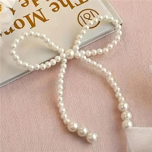 Pearl Bow Cake Decoration - Non Edible. Food Safe Pearl Bow Cake Decoration - Non Edible. Food Safe