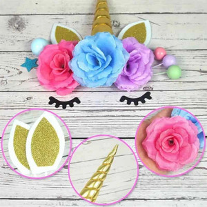 TM Cake Supplies Unicorn Cake Decoration Set - 38 Piece, colorful unicorn themed cake topper with pink, blue, and purple roses, golden horn, glittery ears, and decorative elements for birthday cakes. TM Cake Supplies Unicorn Cake Decoration Set - 38 Piece, colorful unicorn themed cake topper with pink, blue, and purple roses, golden horn, glittery ears, and decorative elements for birthday cakes.