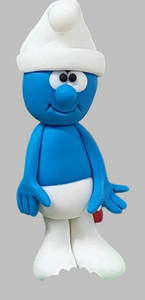 Fondant Smurf Cake Decoration - Handmade, detailed blue fondant figurine of Smurf wearing a white hat and pants, in a cute standing pose for cake decoration. Fondant Smurf Cake Decoration - Handmade, detailed blue fondant figurine of Smurf wearing a white hat and pants, in a cute standing pose for cake decoration.