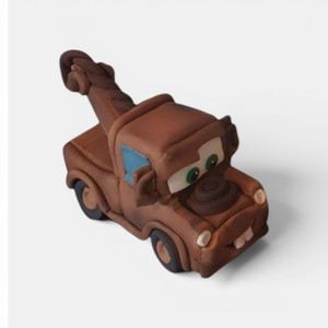Handmade Cars-inspired gumpaste cake toppers featuring red racing car, yellow sports car and brown tow truck characters sold individually.