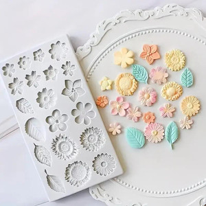 TM Cake Supplies Floral Design Silicone Mould - Multi Cavity, floral and leaf-shaped cake decorating mould with various flower and leaf designs. TM Cake Supplies Floral Design Silicone Mould - Multi Cavity, floral and leaf-shaped cake decorating mould with various flower and leaf designs.