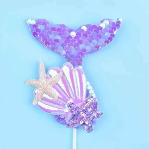 Mermaid Tail Cake Topper, shiny purple and pink seashells with starfish decorations on a stick. Mermaid Tail Cake Topper, shiny purple and pink seashells with starfish decorations on a stick.