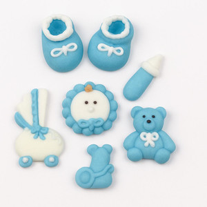 Bakery Sugarcraft Baby Shower Cupcake Toppers - Set of 6, blue baby-themed decorative fondant cupcake toppers including baby shoes, baby bottle, teddy bear, baby carriage, and baby face with blue and white colors. Bakery Sugarcraft Baby Shower Cupcake Toppers - Set of 6, blue baby-themed decorative fondant cupcake toppers including baby shoes, baby bottle, teddy bear, baby carriage, and baby face with blue and white colors.
