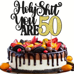 TM Cake Supplies Holy Sh*t You Are 50 Cake Topper, black and gold glitter cake topper with a 50 design, placed on a chocolate and vanilla cake decorated with berries, candies, and cookies. TM Cake Supplies Holy Sh*t You Are 50 Cake Topper, black and gold glitter cake topper with a 50 design, placed on a chocolate and vanilla cake decorated with berries, candies, and cookies.
