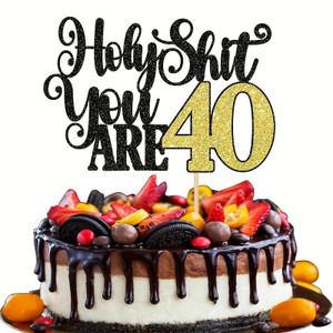 TM Cake Supplies Holy S**t You Are 40 Cake Topper, black glittery text with gold number 40 on a birthday cake decorated with fruit, chocolates, and Oreo cookies. TM Cake Supplies Holy S**t You Are 40 Cake Topper, black glittery text with gold number 40 on a birthday cake decorated with fruit, chocolates, and Oreo cookies.
