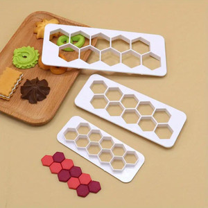 TM Cake Supplies Hexagon Multi Cutter Set – Fondant & Gumpaste Tool, white plastic cutters with hexagon shapes used for cake decorating and fondant shaping. TM Cake Supplies Hexagon Multi Cutter Set – Fondant & Gumpaste Tool, white plastic cutters with hexagon shapes used for cake decorating and fondant shaping.