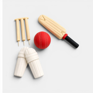 Handmade gumpaste cricket cake decorations featuring cricket bat, red cricket ball, wickets and batting pads for cricket-themed cakes.