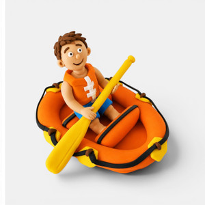 Handmade gumpaste rafting cake topper featuring a male or female adventurer sitting in an inflatable rafting boat with paddle.