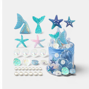 Mermaid cake decoration set with mermaid tails, seashells, starfish, pearls and ocean-themed cake decorations