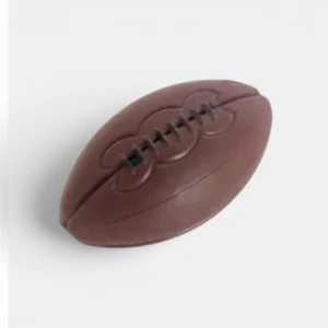 Mini brown rugby ball cake decoration with moulded lace and seam detail for rugby themed birthday cakes