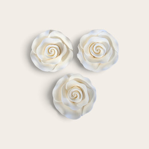 Handcrafted white gumpaste rose cake decoration measuring approximately 4.5cm x 3cm, sold individually for wedding and celebration cakes.