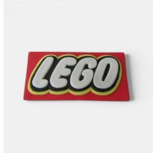 Handmade edible fondant LEGO logo plaque cake decoration in red, white, black and yellow colours.