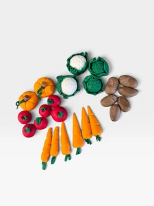 Handmade gumpaste vegetable cake decorations featuring pumpkins, cabbages, tomatoes, carrots, potatoes and pea pods for gardening-themed cakes.