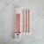 Rose gold tall cake candles 12 pack with holders