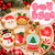 Christmas Cookie Embosser Cutter Set 8 Piece featuring pink plastic cutters with Santa, bells, reindeer, snowman, stocking, snow globe, mitten and candy cane designs.